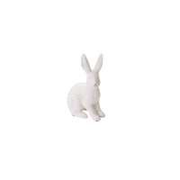 White rabbit figurine on a white background