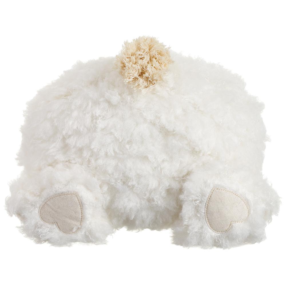 White fluffy pillow shaped like a bunny butt on a white background