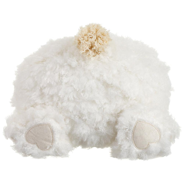 White fluffy pillow shaped like a bunny butt on a white background