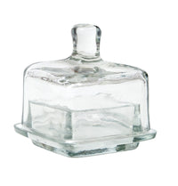 Clear square glass jam jar with lid on a white background