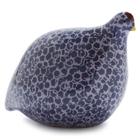 Blue patterned quail-shaped figure on a white background