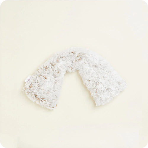 White fluffy neck wrap on a light beige background