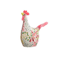 Decorative chicken-shaped decor with floral pattern on a white background