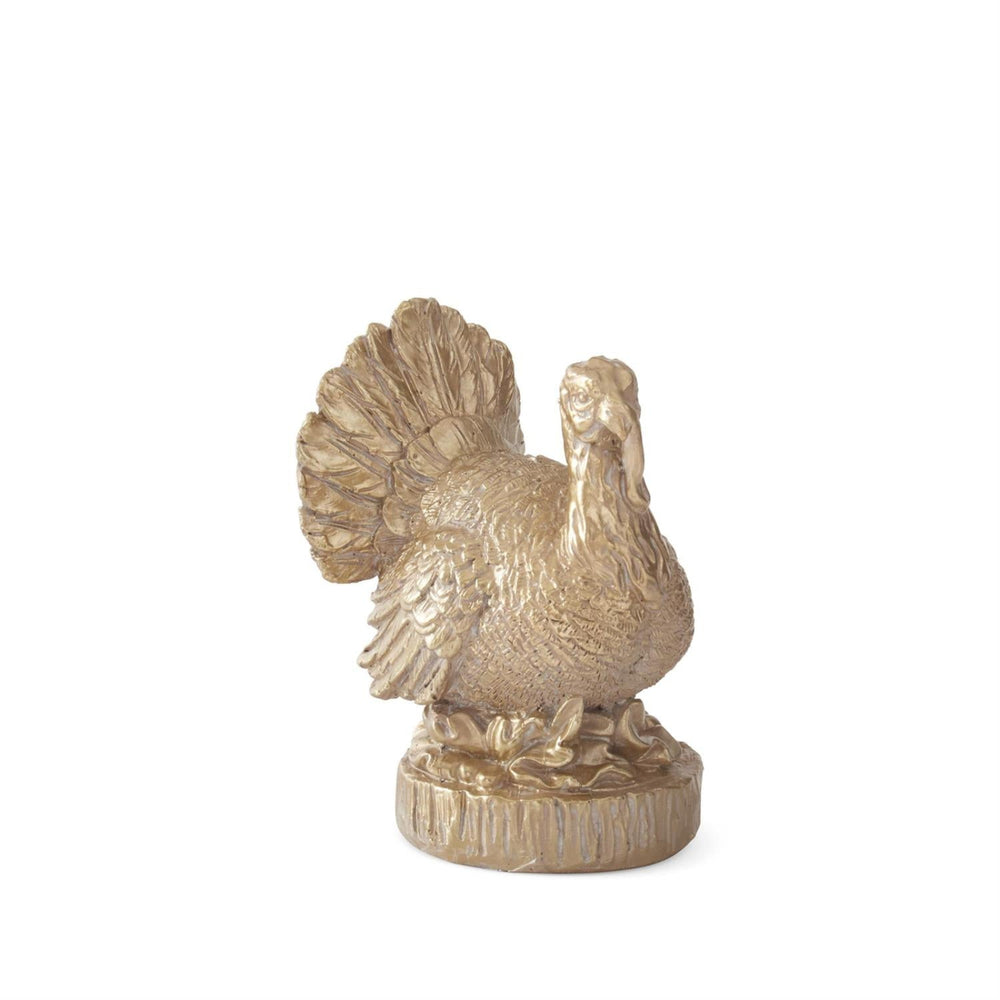 Gold turkey figurine on a white background
