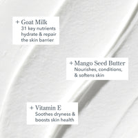 Close-up of a skincare product with text highlighting goat milk, mango seed butter, and vitamin E benefits.