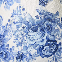 Close-up of blue floral pattern on a white background