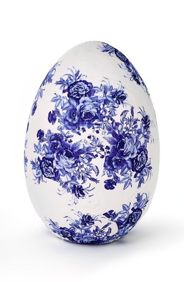 Decorative egg with blue floral pattern on a white background