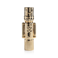 Gold nutcracker-shaped figurine on a white background