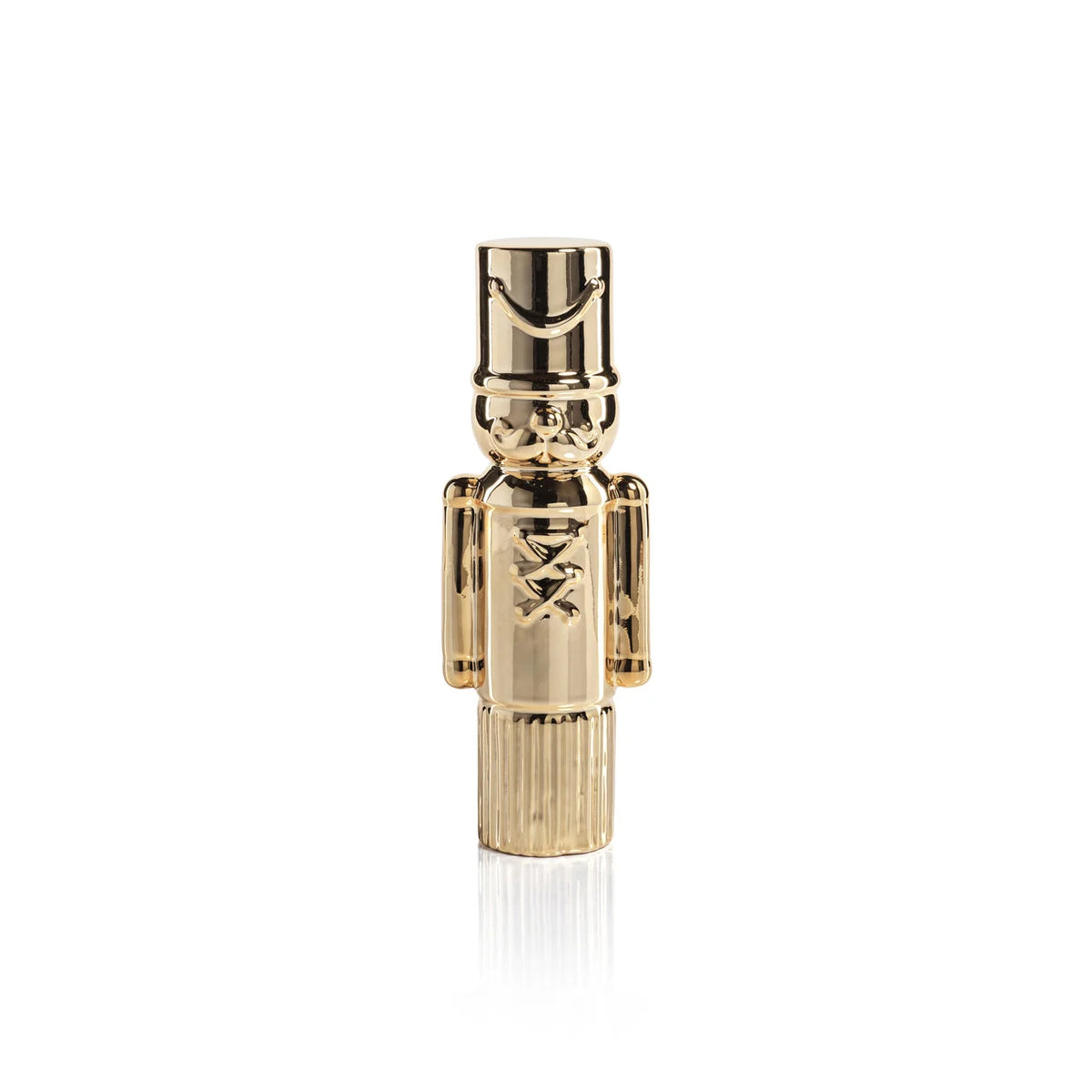 Gold-colored nutcracker figurine on a white background