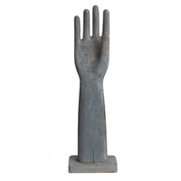 Decorative wood hand sculpture on a white background