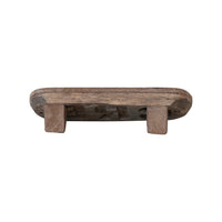 The back of areclaimed wood chalk board on a white background showing the angled feet the wood can rest on.