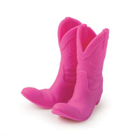 Pair of pink cowboy boots meant to be a phone stand on a white background