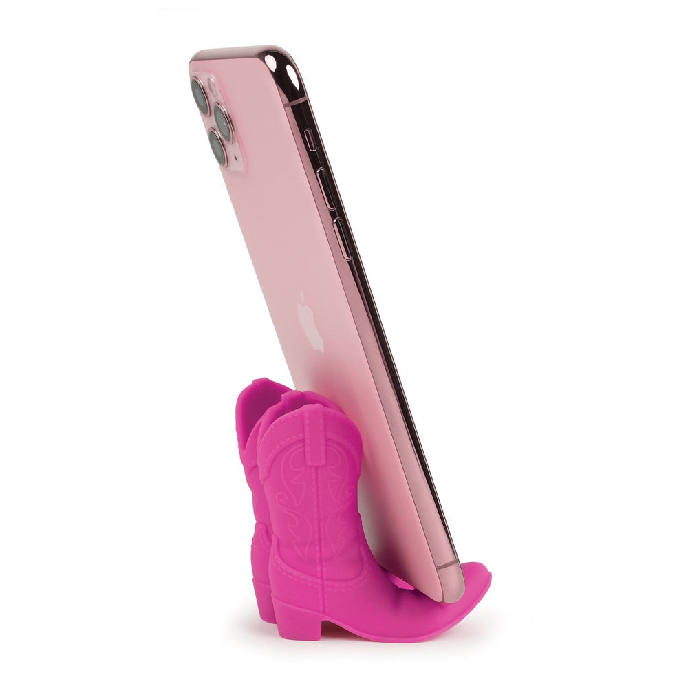 Pink phone holder shaped like a cowboy boot on a white background