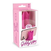 Pink phone stand with packaging on a white background