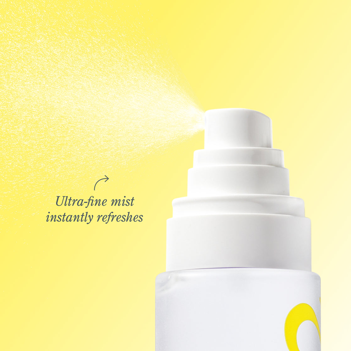 A close-up of a white spray bottle nozzle releasing a fine mist against a bright yellow background, with the text 'Ultra-fine mist instantly refreshes' beside it.