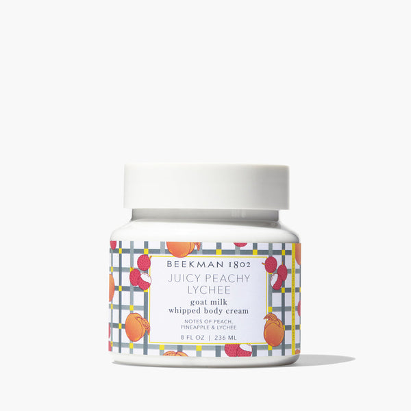 Jar of Beekman 1802 Juicy Peachy Lychee whipped body cream on a white background