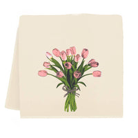 Beige towel with pink tulip design on a white background