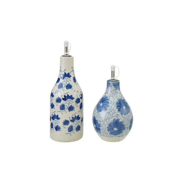 Two ceramic oil cruet bottles with blue floral patterns on a white background