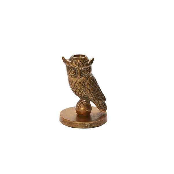 Bronze owl-shaped candle holder on a white background