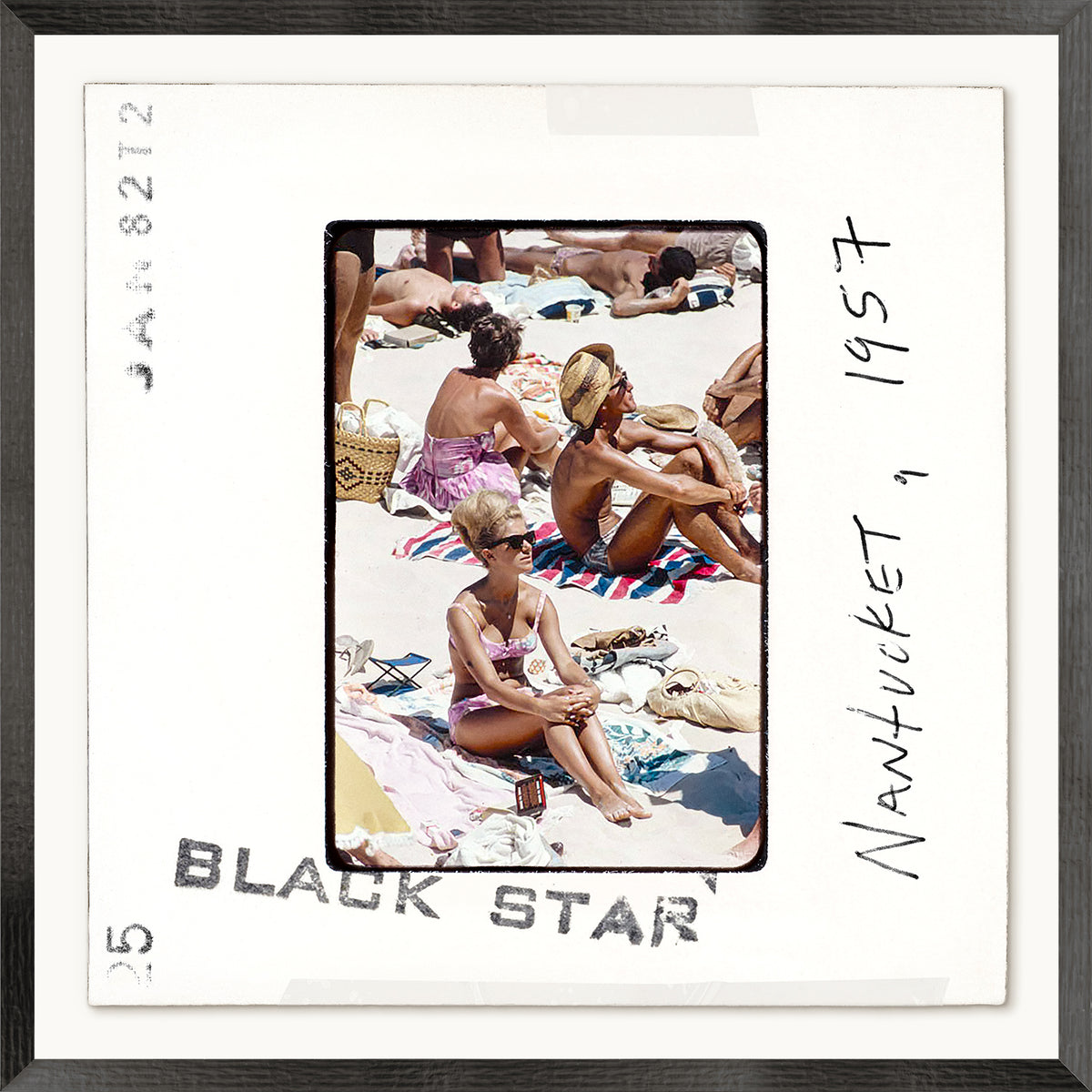Framed photo of people on a beach with text 'Black Star Nantucket 1957'.