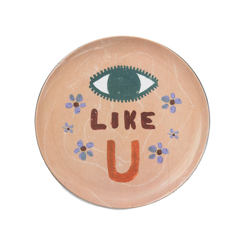 Round melamine plate with eye design and 'LIKE U' text on a white background