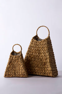 Two woven bags, one larger and one smaller, on a light gray background.
